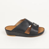 Black leather slip-on sandal with two wide straps, a silver-toned rectangular buckle, brown insole, and black platform sole.