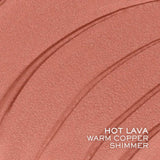 Warm copper shimmer makeup swatch with three curved streaks.