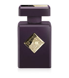 Initio Parfums Privés Can't Get Enough 90ml perfume bottle styled beside its premium dark purple presentation box adorned with elegant gold branding and filigree, from blue salon.