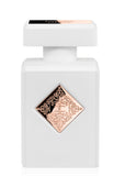 Initio Parfums Privés Lift Me Up Extrait de Parfum in its signature opaque matte white bottle, featuring an intricate rose-gold diamond emblem on the front, available at blue salon.