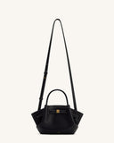 Black pebbled mini tote bag with flared sides, white contrast stitching, a gold-toned buckle, top handles, and a long shoulde