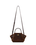 Dark brown faux fur mini tote bag with a smooth top handle, long adjustable shoulder strap, and a gold-toned rectangular clas