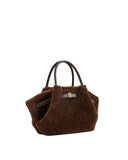 Dark brown faux fur mini tote bag with two dark brown handles and a front strap with a gold-toned rectangular buckle.