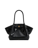 Black crocodile-embossed medium tote bag with two top handles, a gold-toned rectangular clasp, and flared sides.