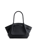 Black pebbled leather medium tote bag with two top handles, folded sides, and white contrast stitching.