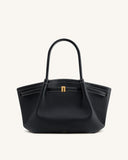 Black pebbled tote bag with two top handles, white contrast stitching, gold-toned rectangular clasp, and JW PEI logo.