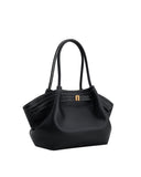 Black pebbled leather medium tote bag with two top handles, white contrast stitching, and a gold-toned rectangular clasp.