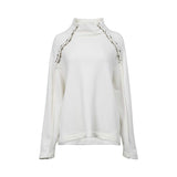 White long-sleeve women’s top with high neckline and metallic stud detailing, minimalist elegant design on a clean white background.