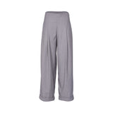Grey wide-leg tailored trousers with high waist, front pleats, cuffed hems, and a clean minimalist finish, photographed on a white background.