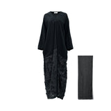 A Front View, high-end black abaya by JIJIL featuring a smooth matte top and a textured lower half with 3D floral embroidery, shown alongside a matching sheer black headscarf against a white background.