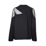 JIJIL black long-sleeve top with sheer mesh panels on shoulders and upper sleeves, crew neckline, displayed on a white background.