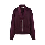 Burgundy zip-front jacket with shawl collar, long sleeves, ribbed hem, relaxed fit, and smooth structured fabric, photographed on a white background.