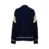 JIJIL navy blue knit sweater with long sleeves, contrast beige and white sleeve panels, a high neckline, and ribbed cuffs, photographed on a white background.