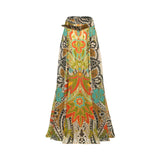 A long, wide-leg skirt with a vibrant bohemian paisley pattern in green, orange, turquoise, black, and beige, featuring a matching fabric belt at the waist, shown against a plain white background.