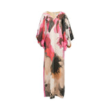 Long V-neck dress with voluminous sleeves and pink cuffs. Features an abstract print in pink, black, brown, and cream with gl