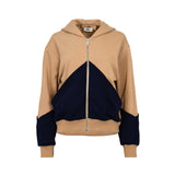 Camel and navy zip-up hoodie with hood, contrast geometric front panel, long sleeves, ribbed cuffs, and ribbed hem, photographed on a white background.