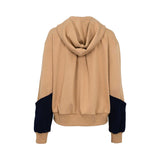 Camel and navy zip-up hoodie with hood, contrast geometric front panel, long sleeves, ribbed cuffs, and ribbed hem, photographed on a white background.