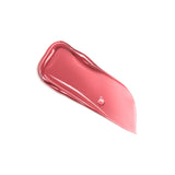 A glossy, wavy swatch of pink lip gloss with a small bubble, tapering to a point.