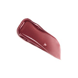 Wavy swatch of glossy, deep reddish-brown lip product with a high shine finish and small bubbles.