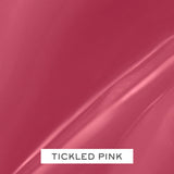 A swatch of Tickled Pink, a medium pink lip gloss with a glossy finish.