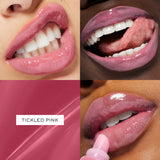 Lancome Juicy Tubes lip gloss in Tickled Pink, a glossy, translucent pink with a soft, rounded applicator tip.