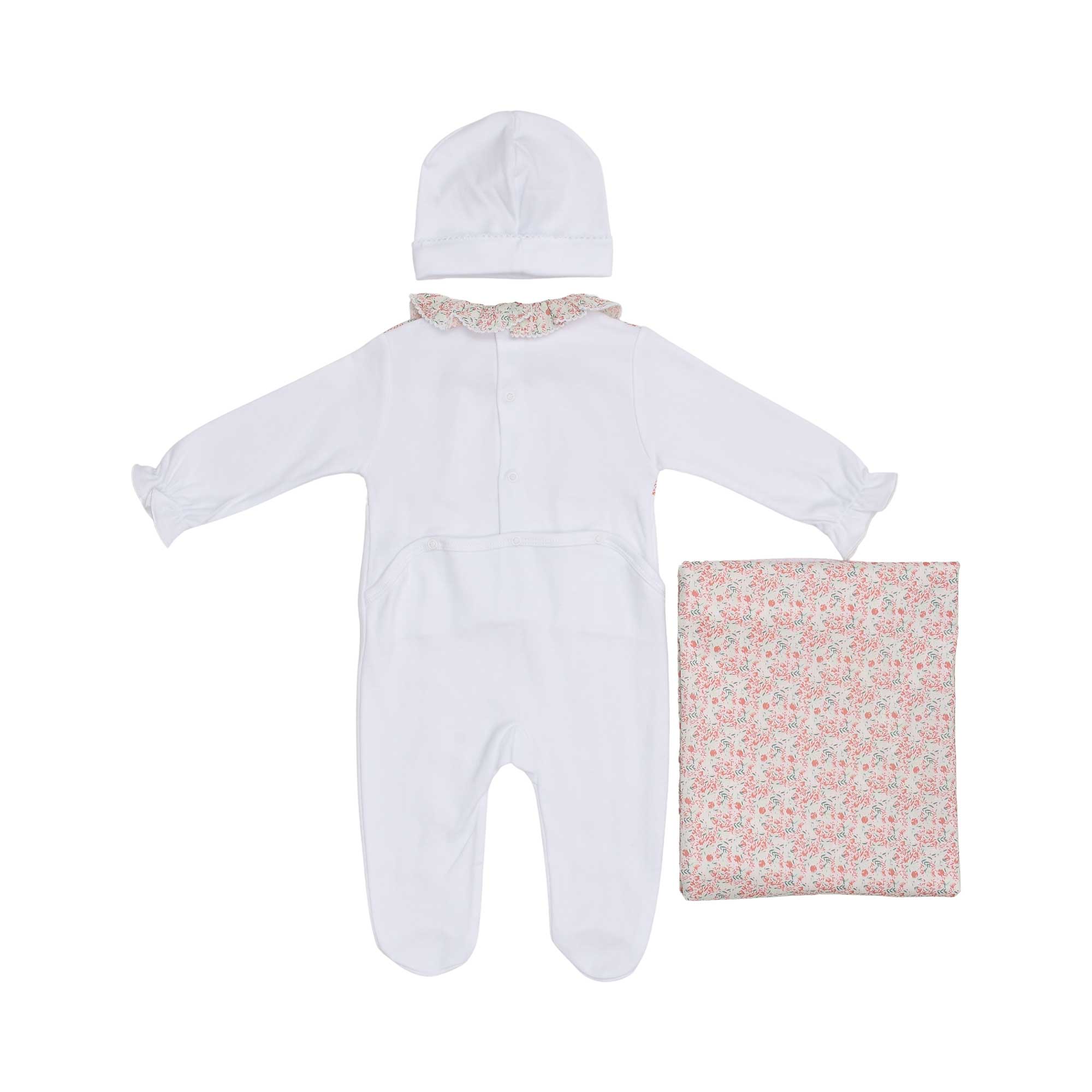 Back view of the baby sleepsuit showing the snap-button fasteners and the matching white beanie and folded floral blanket.