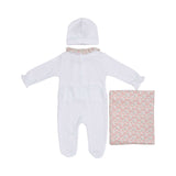 Back view of the baby sleepsuit showing the snap-button fasteners and the matching white beanie and folded floral blanket.