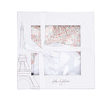 A full view of the square swaddle blanket from Jules & Juliette Paris, featuring an all-over pink and green floral pattern on a white background.