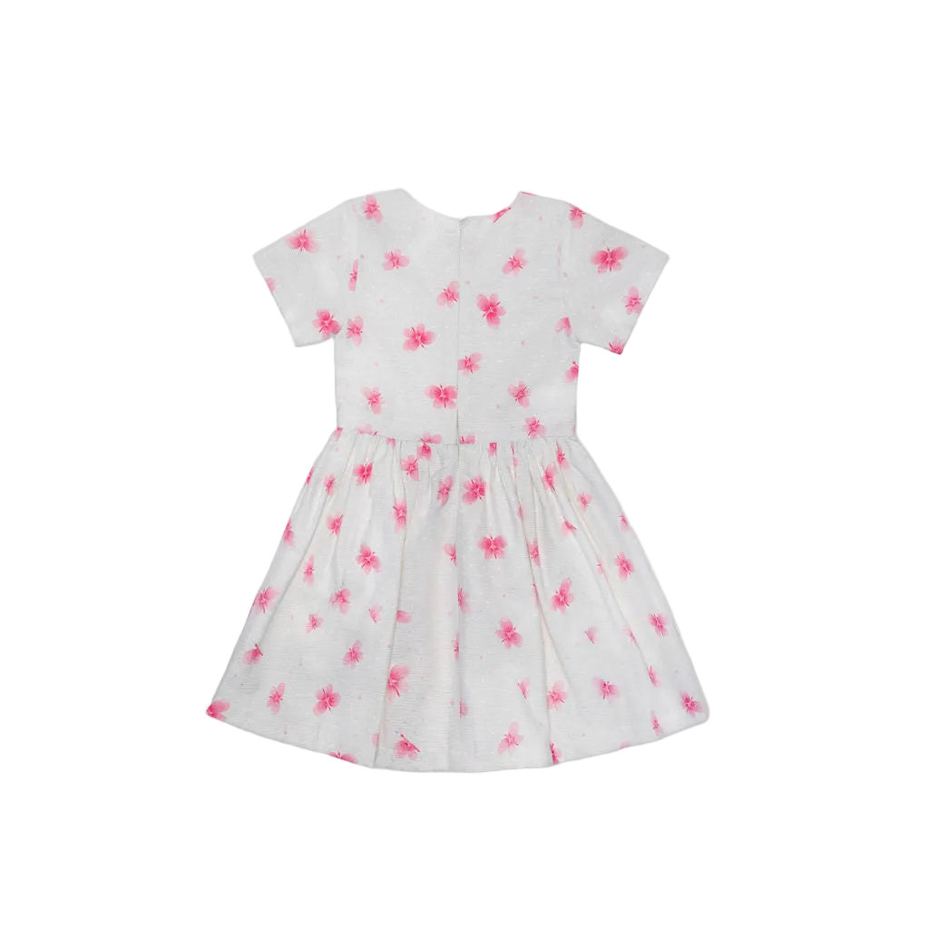 The reverse of the Jules & Juliette Paris butterfly print dress, showing the seamless pattern across the back and sleeves with a clean round neckline.