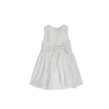Front view of a white sleeveless girls' dress by Jules & Juliette Paris featuring horizontal pleats and a large decorative bow on the waist.