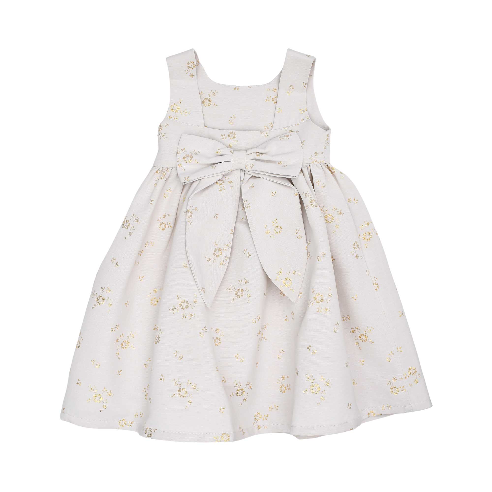 Back view of the Jules & Juliette Paris gold floral dress highlighting the large decorative bow at the waist and the square back neckline.