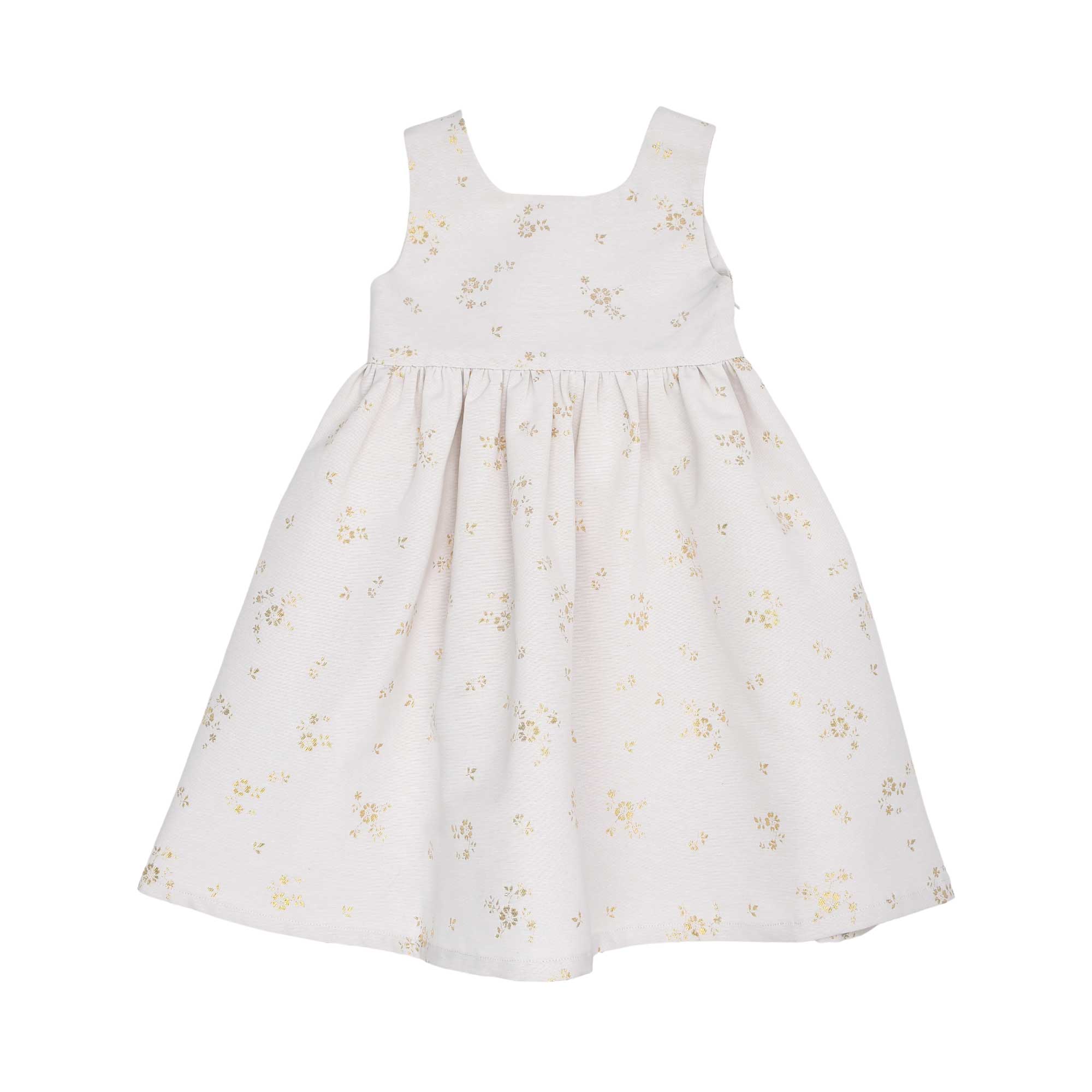 Front view of a Jules & Juliette Paris girls' sleeveless off-white jacquard dress featuring a metallic gold floral pattern and a gathered skirt.