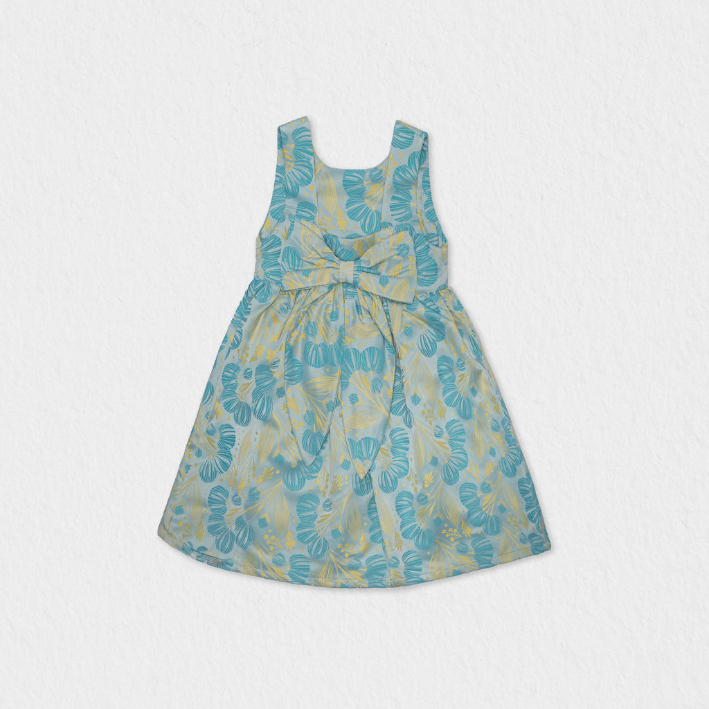 Back view of the Jules & Juliette Paris green dress highlighting the large decorative bow at the waist and the square back neckline.