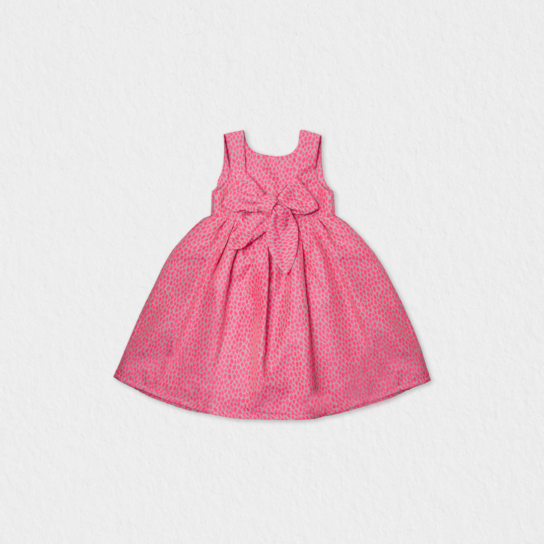 Back view of the Jules & Juliette Paris pink dress highlighting the large decorative bow at the waist and the square back neckline.