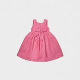 Back view of the Jules & Juliette Paris pink dress highlighting the large decorative bow at the waist and the square back neckline.
