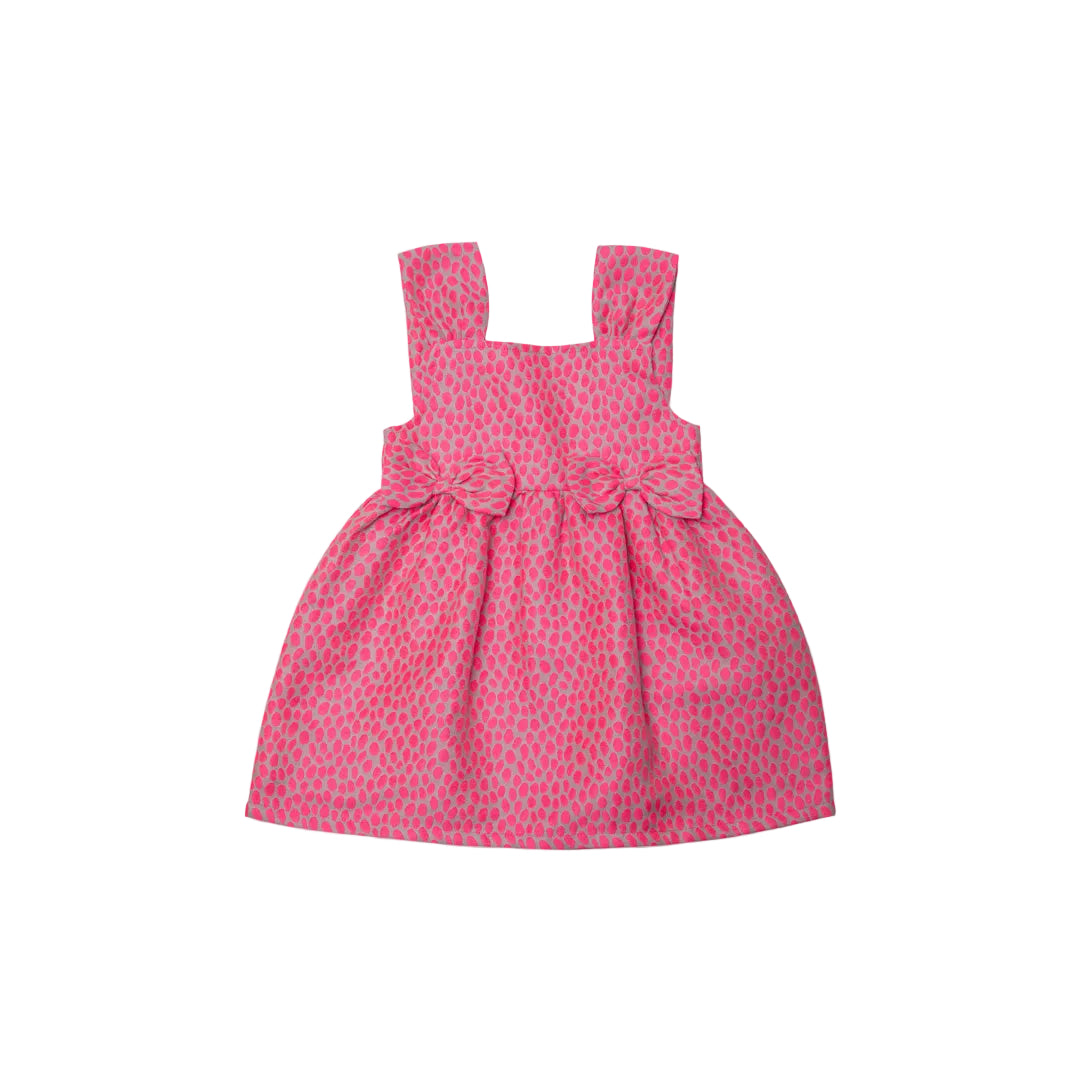 Front view of sleeveless dress in a pastel yellow, pink, and green textured fabric with two bows at the waist.