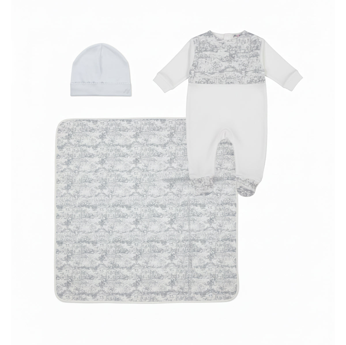 A three-piece luxury baby clothing set by Jules & Juliette Paris featuring a white and grey Toile de Jouy pattern. The set includes a long-sleeve footed romper, a matching white beanie hat, and a square patterned baby blanket laid out on a white background.