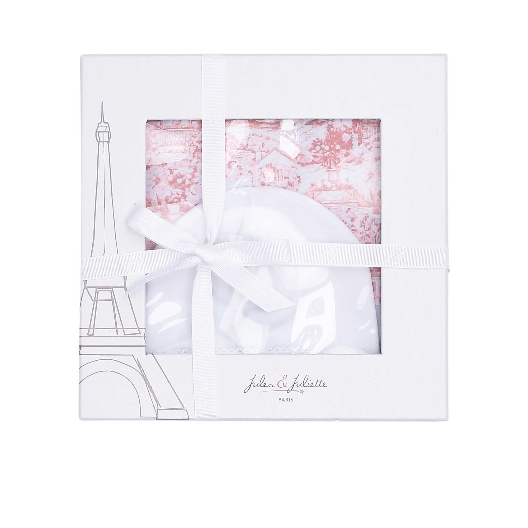 Signature Jules & Juliette Paris gift box with an Eiffel Tower graphic and ribbon, displaying the pink Toile de Jouy baby set inside.
