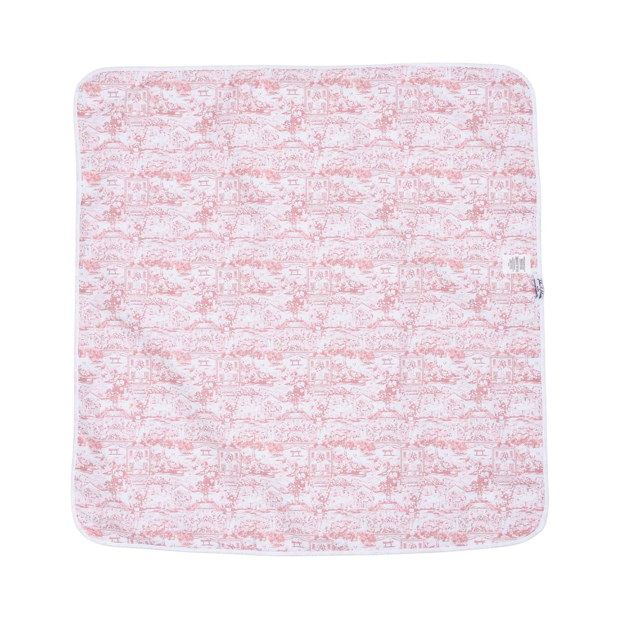 A full, flat view of the square swaddle blanket featuring a rose-pink pastoral Toile de Jouy scene printed on white fabric.