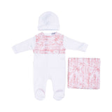 Front view of the Jules & Juliette Paris baby set featuring a white sleepsuit with a pink Toile de Jouy chest panel, a white hat, and a folded blanket.