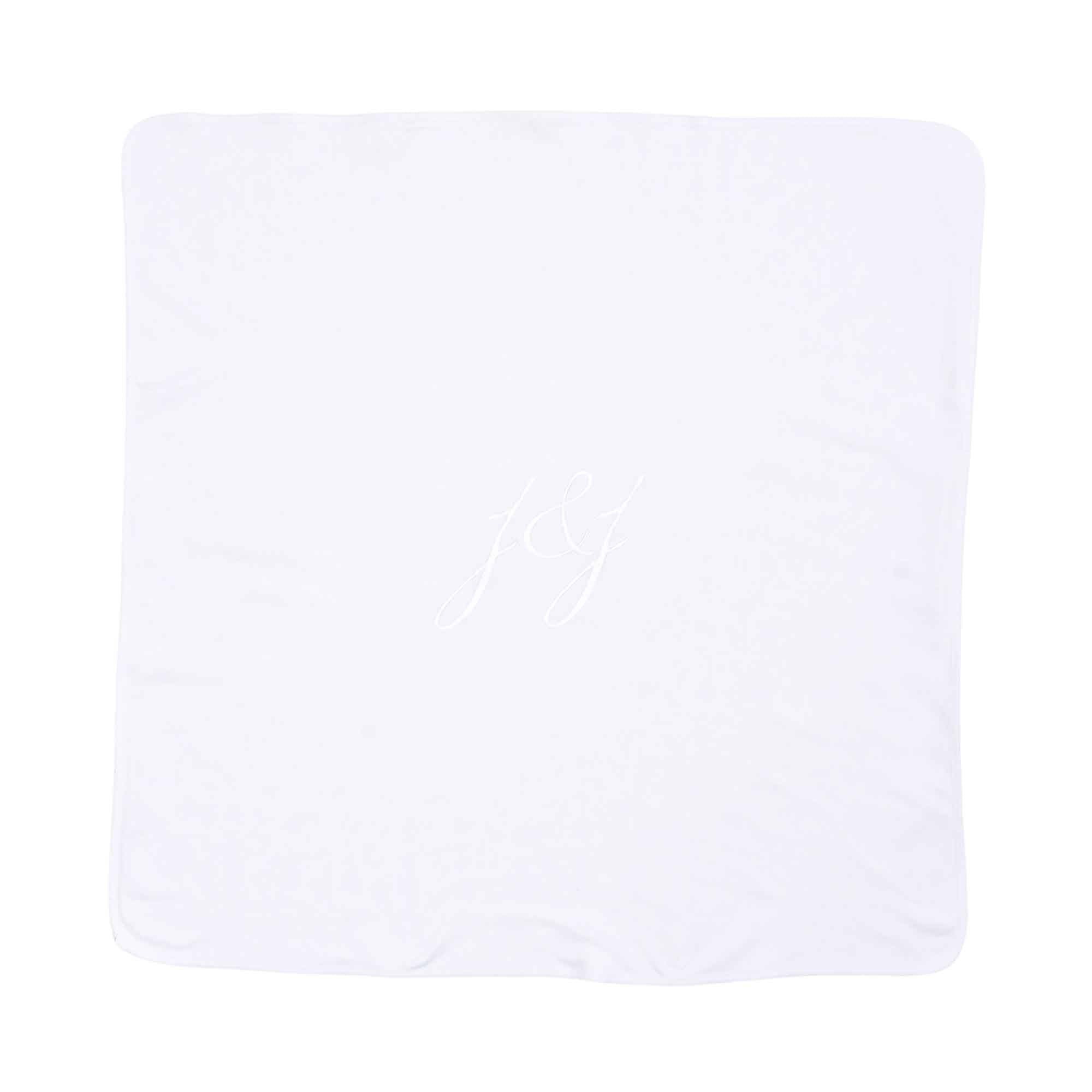 A back view of flat view of the square swaddle blanket featuring the delicate green and pink wildflower motif across the entire surface.