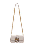Front view of Just Cavalli women's black leather mini chain shoulder bag with signature gold-tone snake buckle and long chain strap