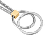 Silver-toned keyring with two interlocking rings, one engraved "SAINT HONORE", attached to a gold-toned block and two coiled
