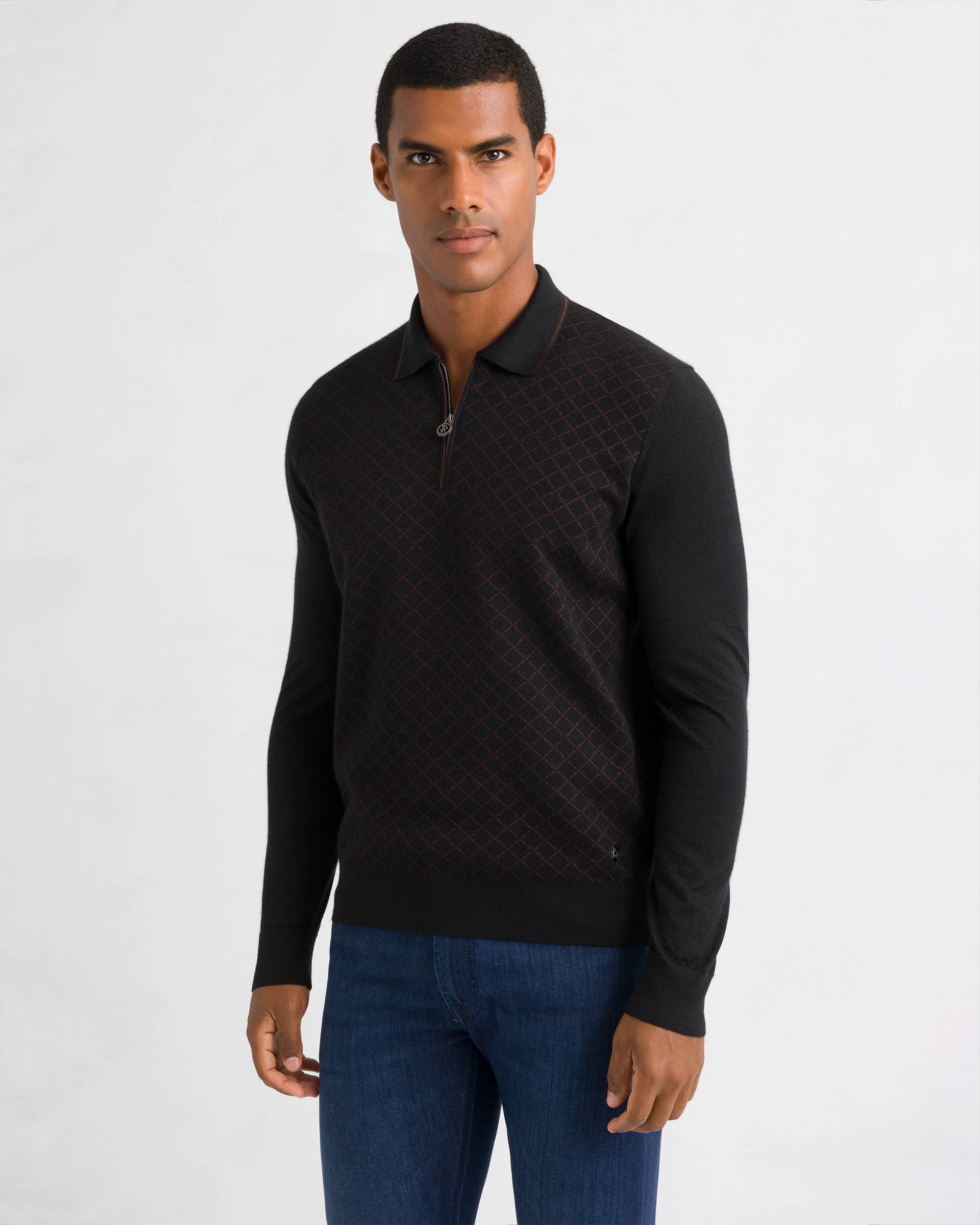 Black knit polo sweater with a silver-toned quarter-zip. Features a dark brown diamond pattern on the chest and solid black s