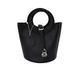 Karisma Sculptural Grained Satchel, where avant-garde geometry meets classic luxury.