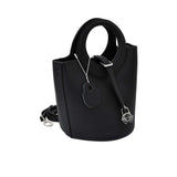 Karisma Sculptural Grained Satchel, where avant-garde geometry meets classic luxury.