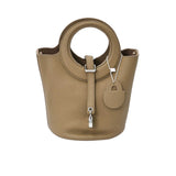Karisma Sculptural Grained Satchel, where avant-garde geometry meets classic luxury.