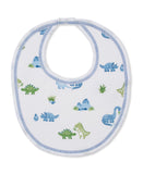 White baby bib with blue zigzag stitching trim, featuring a multicolor print of blue and green dinosaurs, plants, and mountai