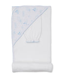 White hooded towel and wash mitt set with light blue celestial pattern featuring suns, moons, stars, and clouds, with scallop
