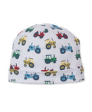 White baby beanie hat with a colorful tractor pattern in red, yellow, blue, and green, and a folded brim.